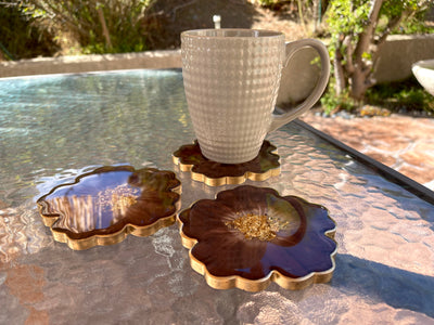 Handmade Chocolate Brown Mocha and Gold Resin Flower Shaped Coasters Set - Jasmin Renee Art - Three Coasters with Cup on Table Outside Gold Rim Edges