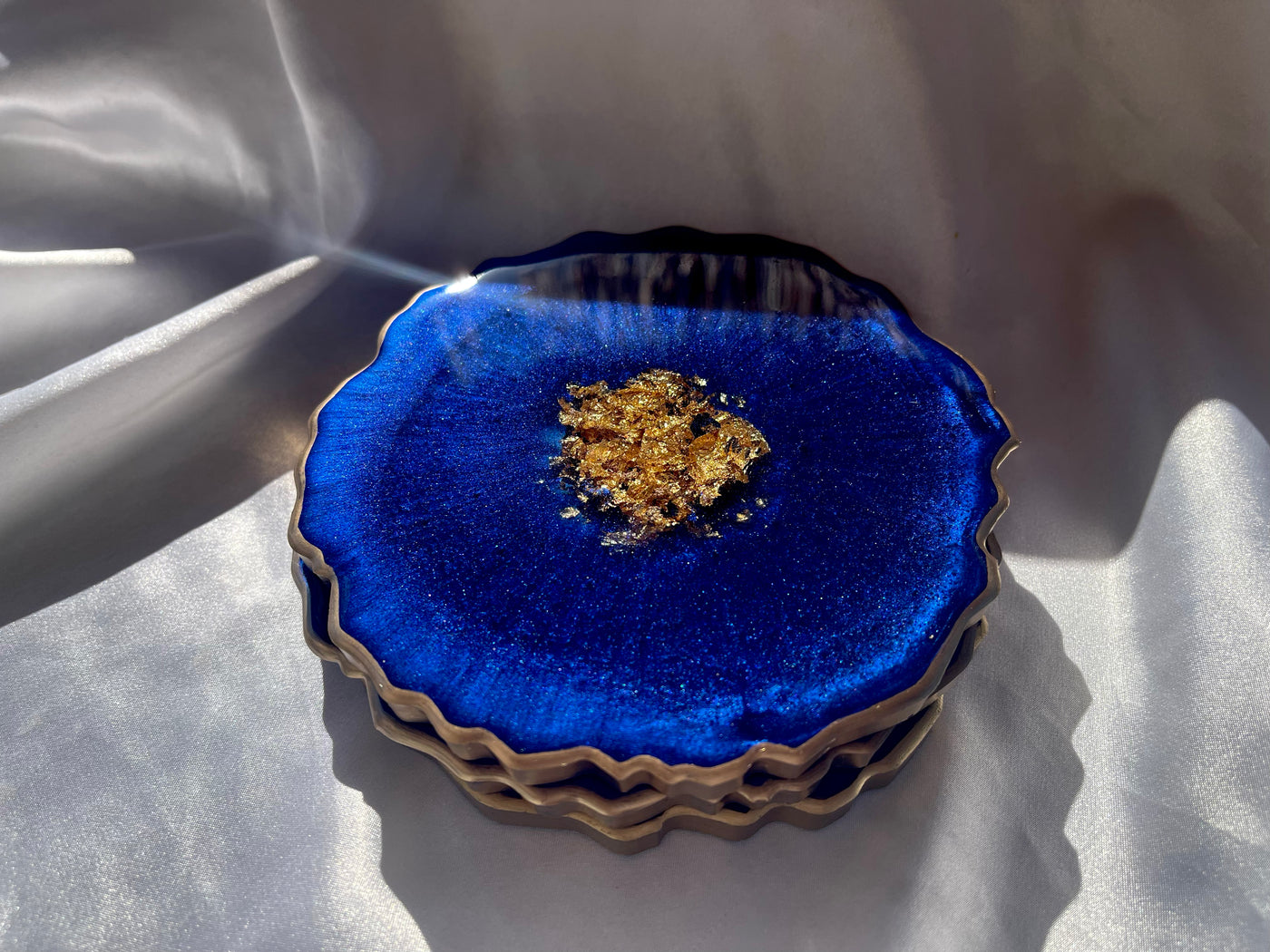Handmade Deep Ocean Blue and Gold Resin Geode Agate Shaped Resin Coasters Set - Jasmin Renee Art - Three Coasters Stacked Gold Rim Edges