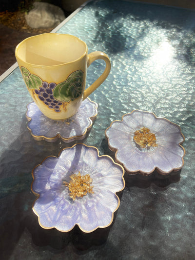Handmade Orchid Violet Lavender Lilac Purple and Gold Resin Flower Shaped Coasters Gold Rim Edges - Jasmin Renee Art - Three Coasters with Cup on Table