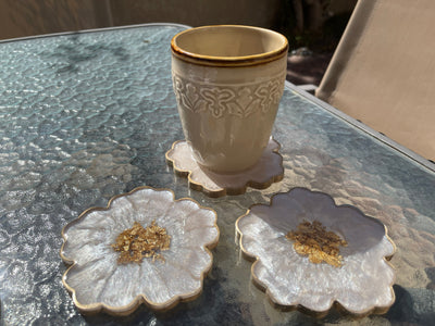 Handmade White Beige Cream and Gold Flower Shaped Coasters  with Gold Accented Rim Edges- Jasmin Renee Art - Three Coasters with Cup on Table